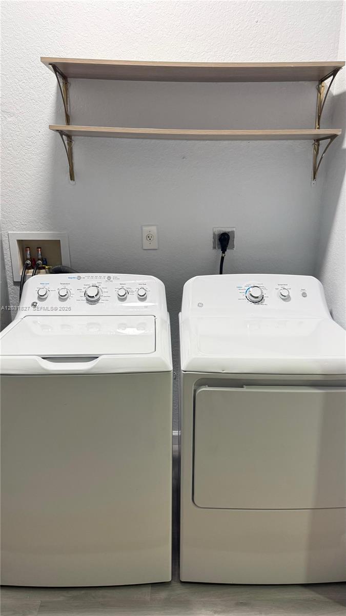 2120 Northeast 37th Road, Unit 1 Homestead, FL 33033 - Photo 27 of 30 a utility room with dryer and washer