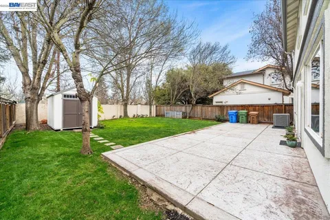a kitchen with stainless steel appliances granite countertop a refrigerator stove and microwave