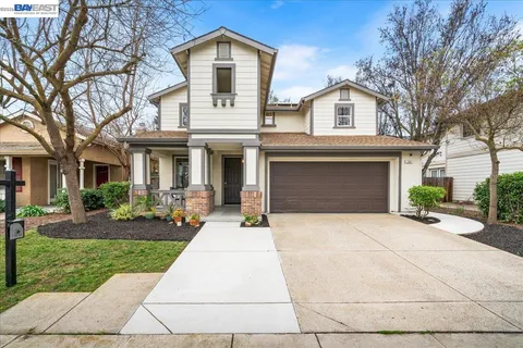 a kitchen with granite countertop a stove and a microwave