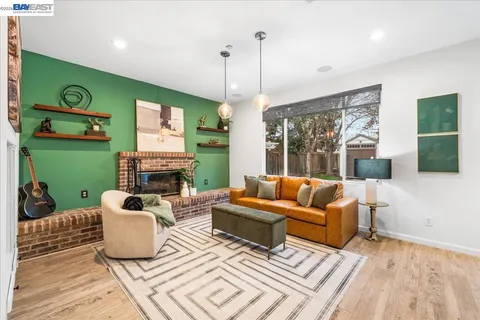 a kitchen with stainless steel appliances granite countertop a sink a stove and cabinets