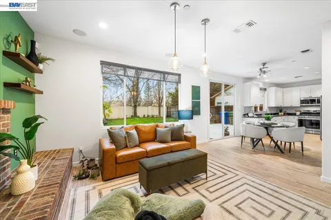 a kitchen with granite countertop a sink and a stove