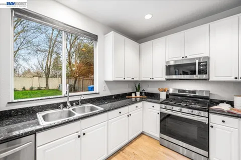 a living room with furniture fireplace and a flat screen tv