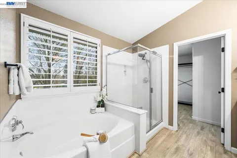 a view of a house with a yard and tree