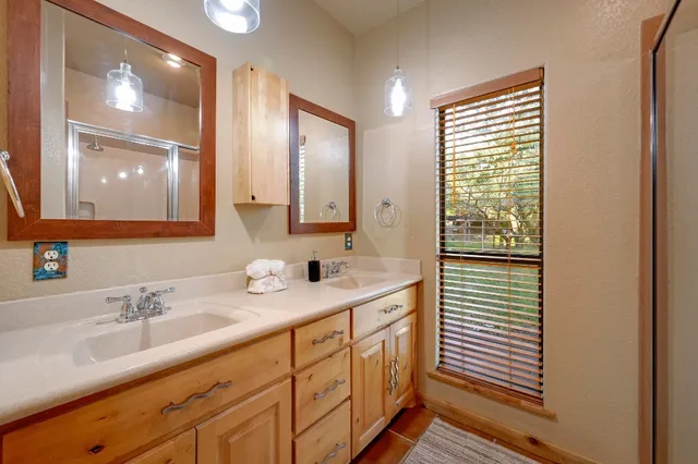 a dining room with furniture a chandelier and wooden floor