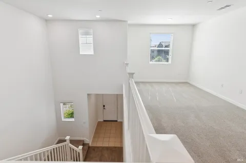 wooden floor with windows and closet