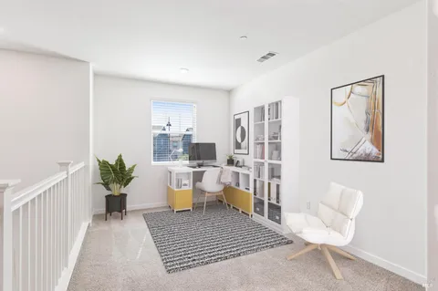 a living room with furniture and a rug