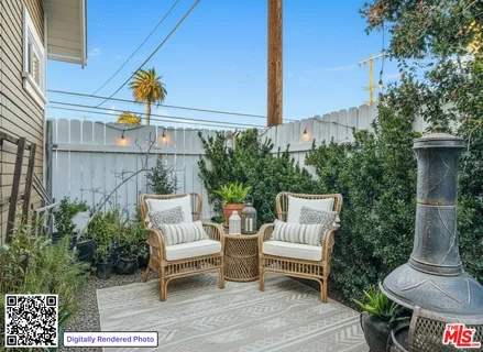 a view of a patio with couches table and chairs and potted plants