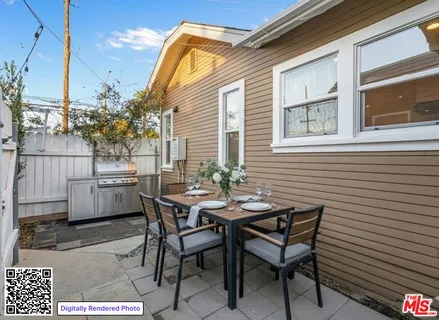 a view of a dinning table and chairs in the balcony
