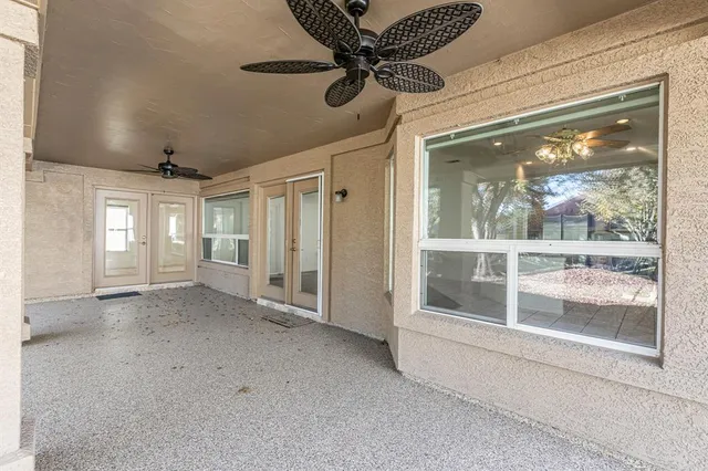 a front view of a house with a garden and yard