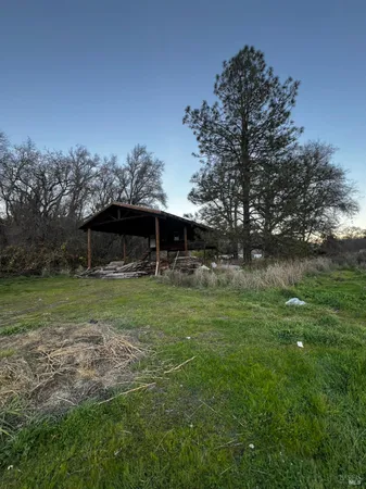 a view of outdoor space with deck and yard