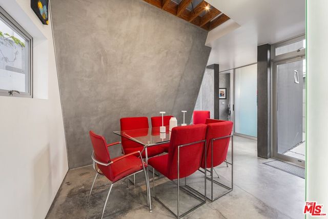 a kitchen with kitchen island a stove a sink and a refrigerator
