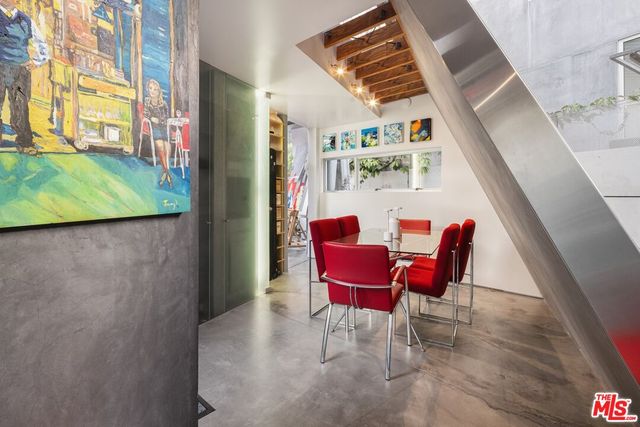 a bathroom with a sink a mirror and a shower