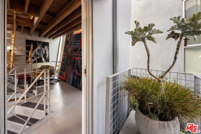 a bedroom with a bed and couch