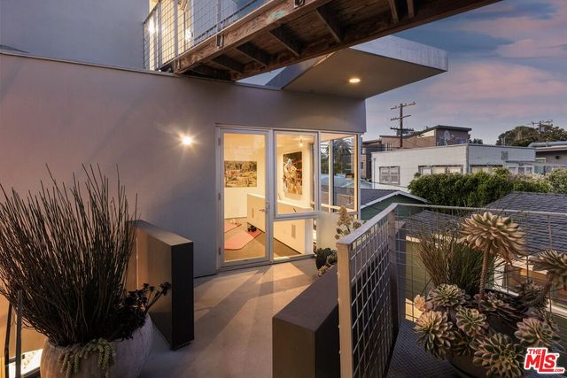 a bedroom with a bed and the view of bathroom