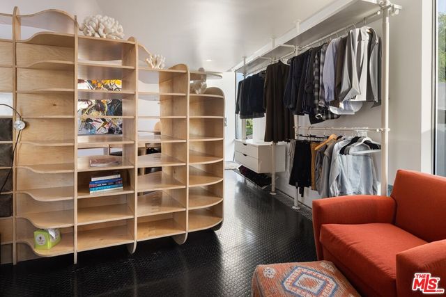 an aerial view of residential houses with outdoor space and street view