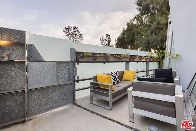 a room with furniture and a flat screen tv