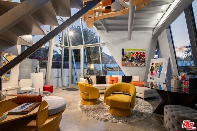 a kitchen with stainless steel appliances a sink stove and cabinets