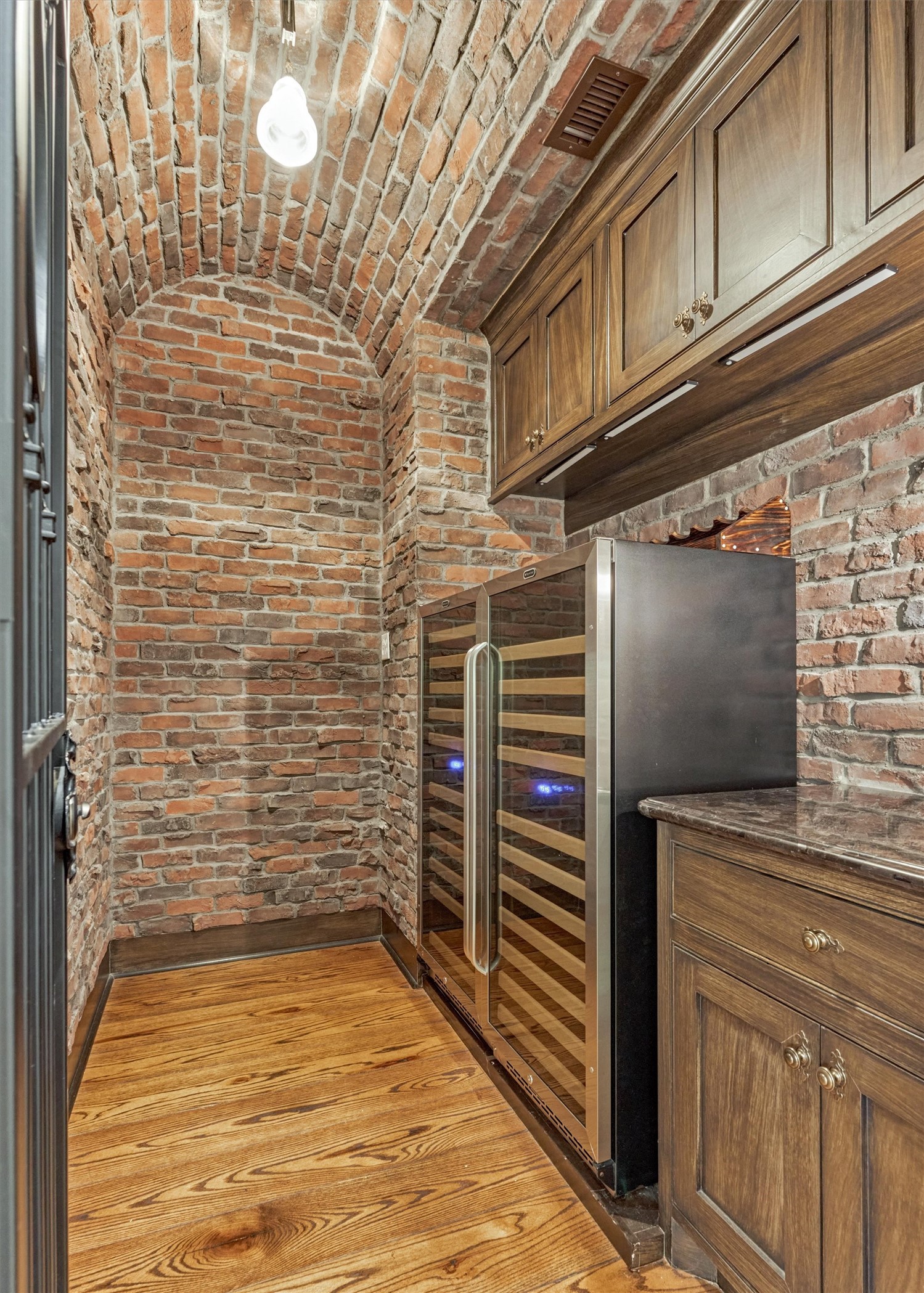 22 East Shore Drive The Woodlands, TX 77380 - Photo 26 of 50 The bricked wall Wine Room/Cellar has two Whynter 92-bottle Dual Zone Built-in Wine Refrigerators.