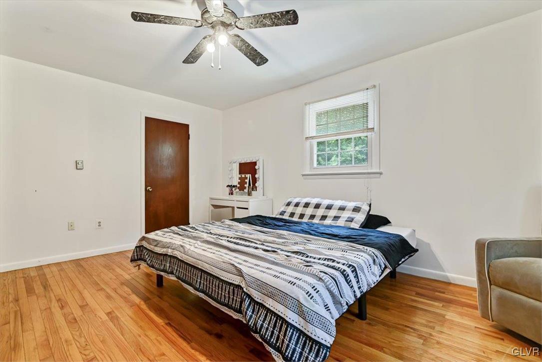 400 Carlton Road Mount Pocono, PA 18344 - Photo 24 of 50 a bedroom with a bed and wooden floor