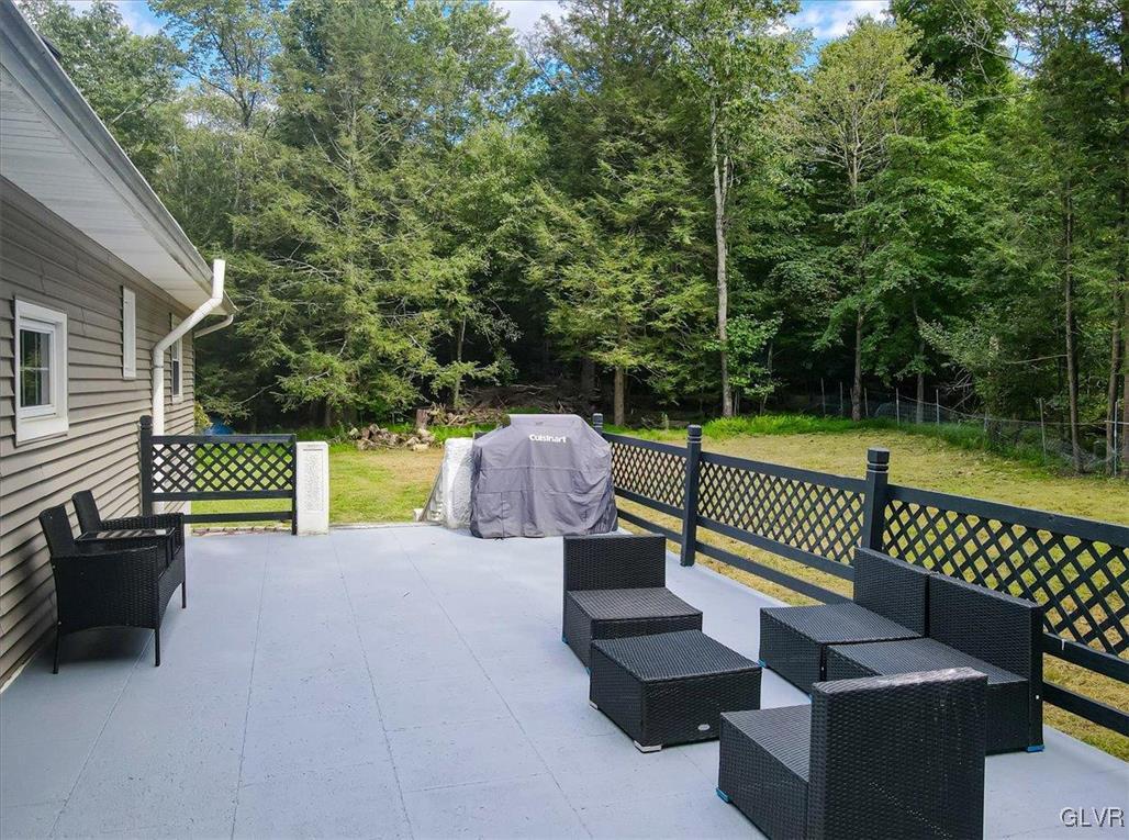 400 Carlton Road Mount Pocono, PA 18344 - Photo 43 of 50 a view of a chair and fire pit in the backyard
