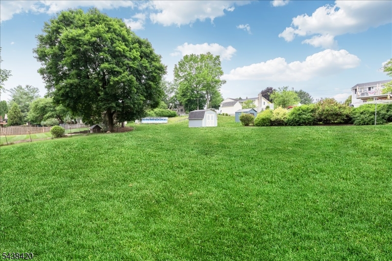 79 Main Street Califon, NJ 07830 - Photo 30 of 50 a view of a garden with a building in the background