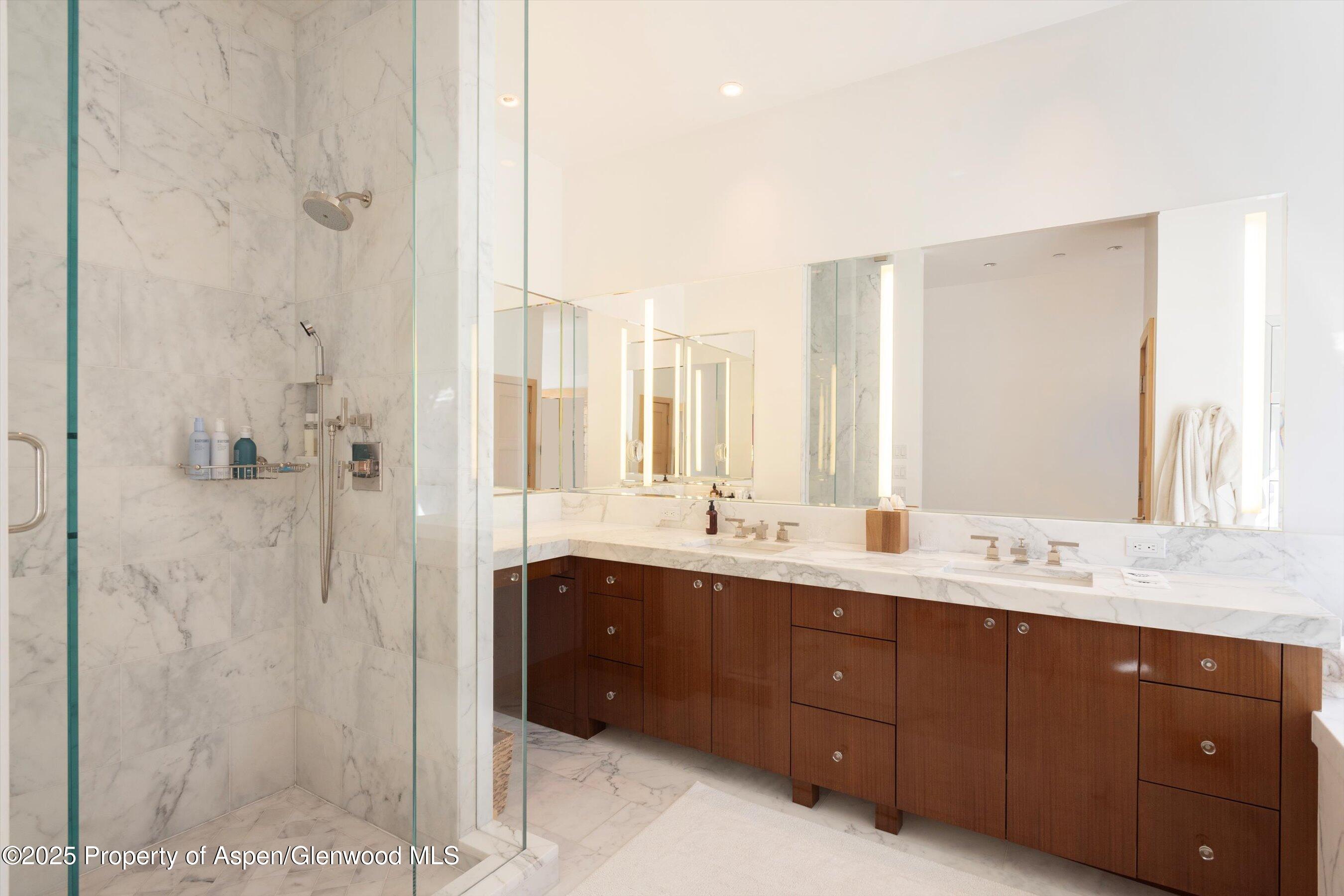6770 Castle Creek Road Aspen, CO 81612 - Photo 20 of 53 a spacious bathroom with a double vanity sink mirror and shower