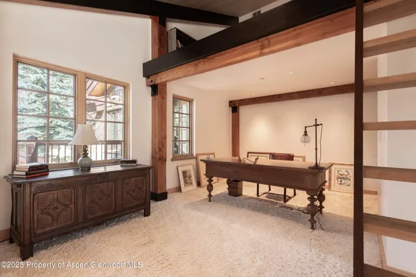 a view of a big room with windows and cabinet