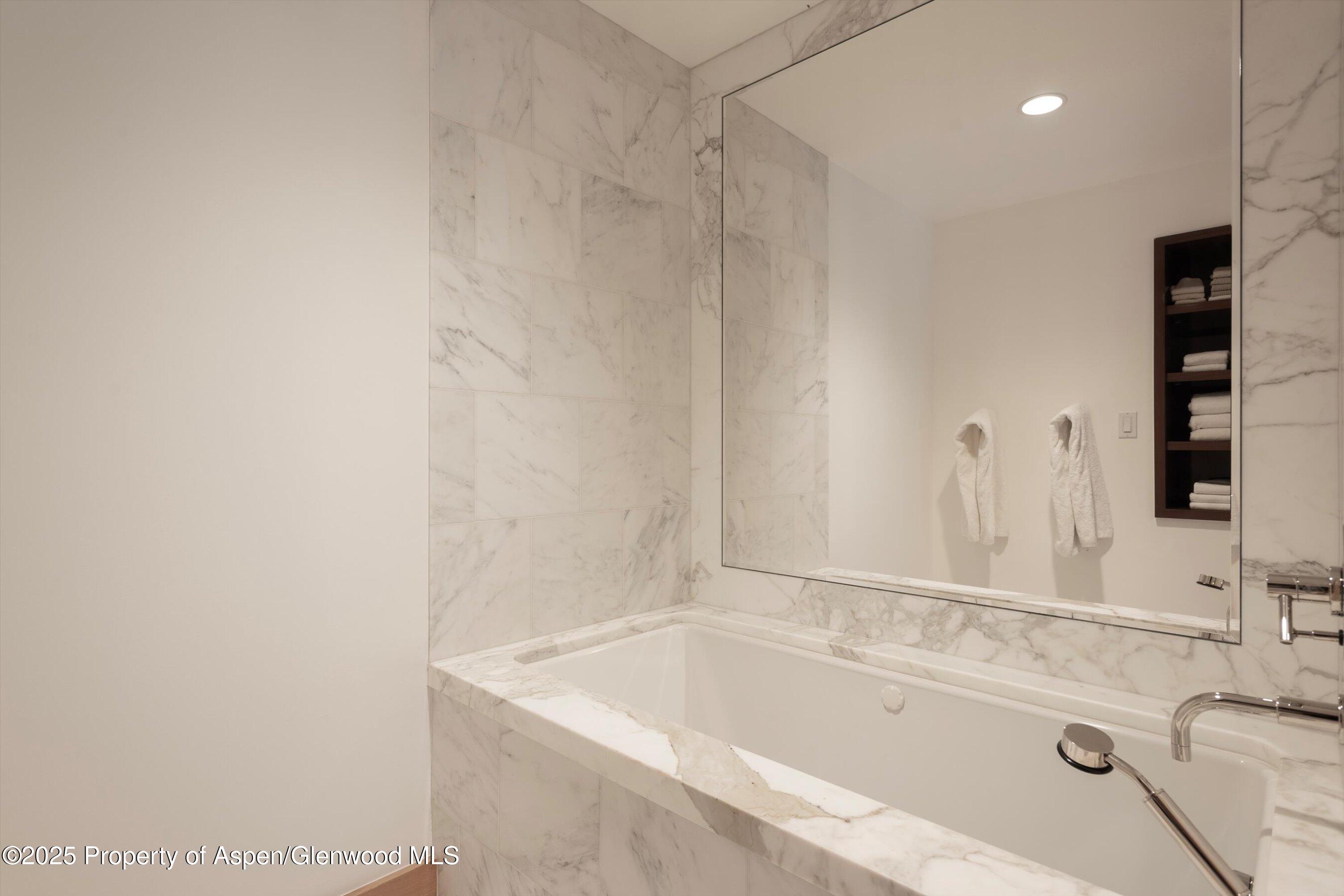 6770 Castle Creek Road Aspen, CO 81612 - Photo 27 of 53 a bathroom with a tub sink and vanity