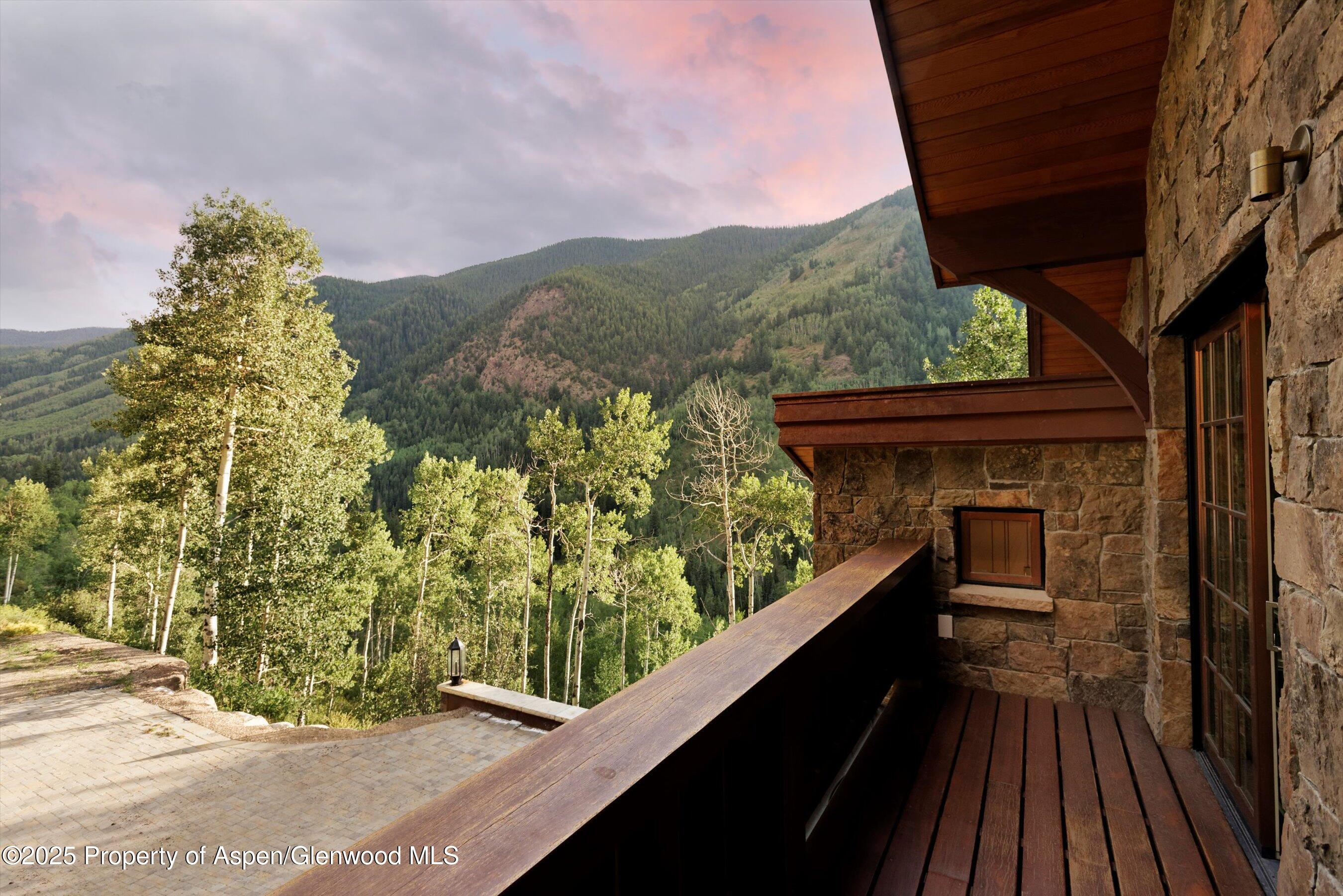 6770 Castle Creek Road Aspen, CO 81612 - Photo 41 of 53 a balcony with table and chairs