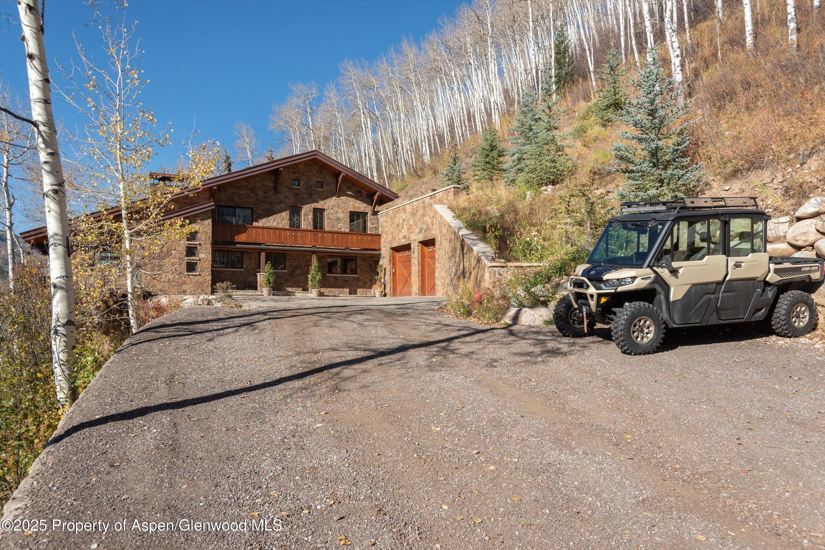 6770 Castle Creek Road Aspen, CO 81612 - Photo 52 of 53 a car parked in front of a building