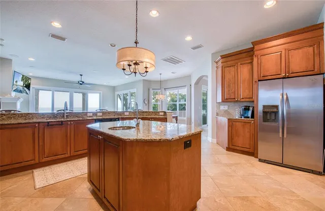 a spacious bedroom with a large bed and a large window
