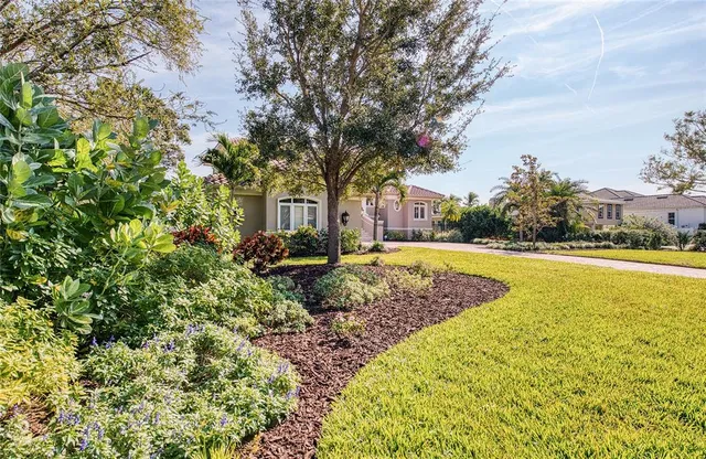 a view of swimming pool with sitting area