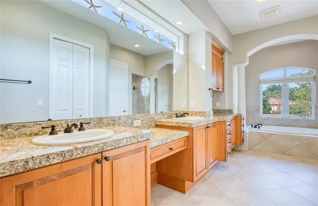 a view of backyard with swimming pool and sitting area