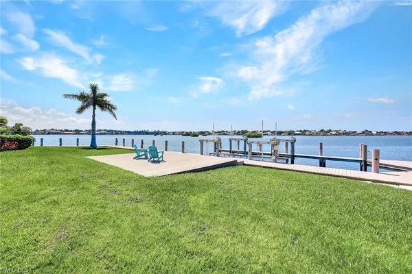 a view of a swimming pool with an outdoor seating