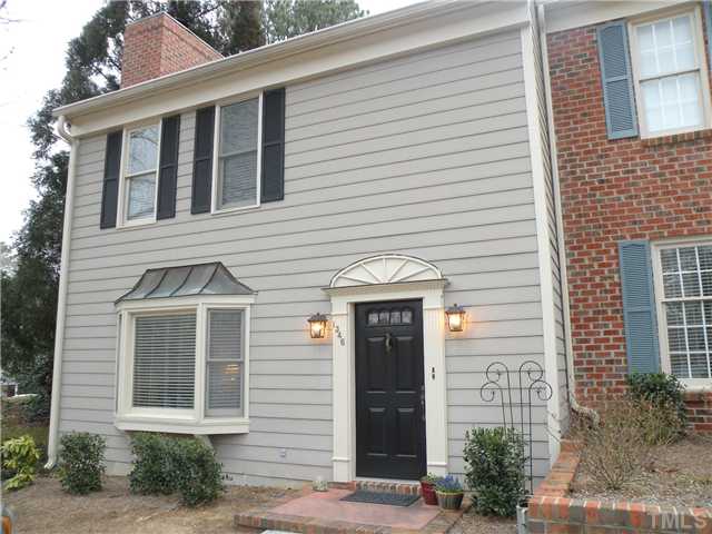 1346 Baez Street Raleigh, NC 27608 - Photo 1 of 12 a front view of a house with a yard