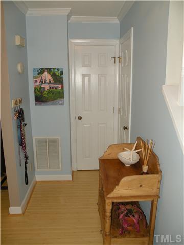 1346 Baez Street Raleigh, NC 27608 - Photo 2 of 12 a bedroom with a bed and a couch