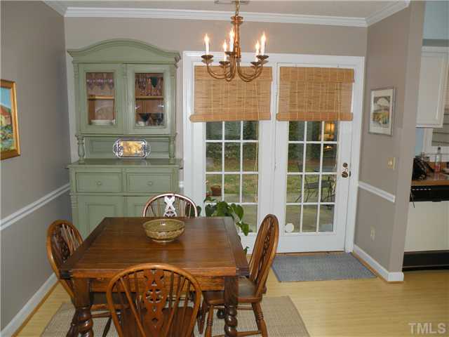 1346 Baez Street Raleigh, NC 27608 - Photo 5 of 12 a view of a dining room with furniture and chandelier