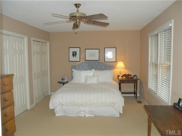 1346 Baez Street Raleigh, NC 27608 - Photo 8 of 12 a bedroom with a bed and a table