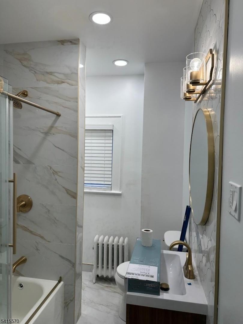 186 Main Avenue Passaic, NJ 07055 - Photo 1 of 13 a bathroom with a sink and a mirror