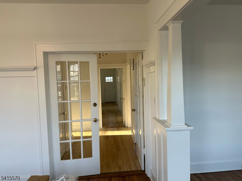 186 Main Avenue Passaic, NJ 07055 - Photo 12 of 13 wooden floor and windows in a room