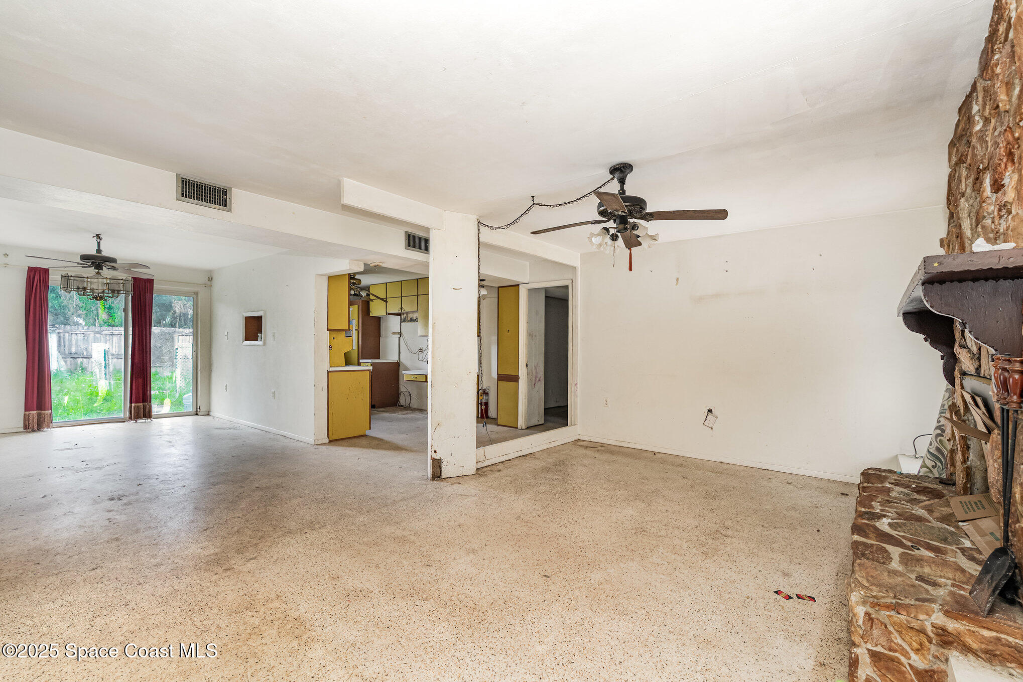 1048 Knecht Road Northeast Palm Bay, FL 32905 - Photo 6 of 23 a view of a room with window and a ceiling fan