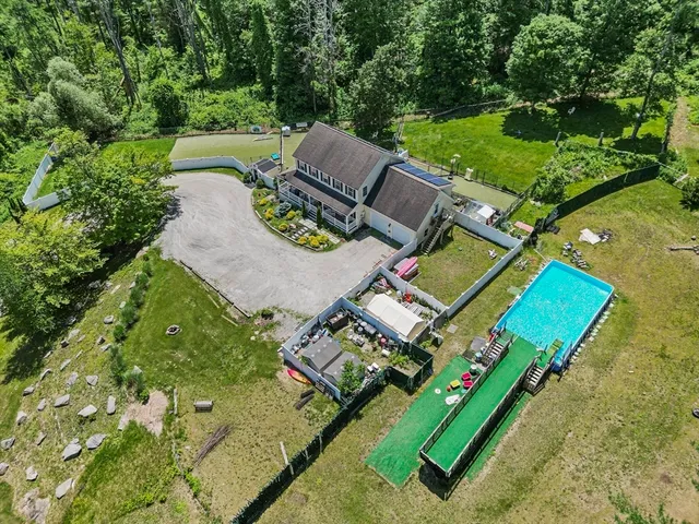 an aerial view of a house with a garden