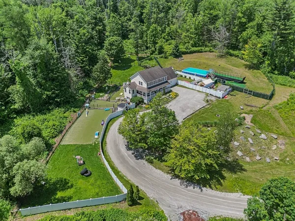 an aerial view of a house with a garden