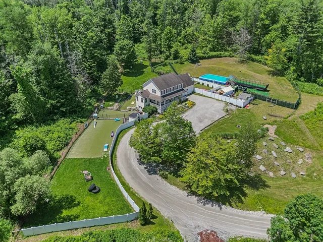 an aerial view of a house with a garden