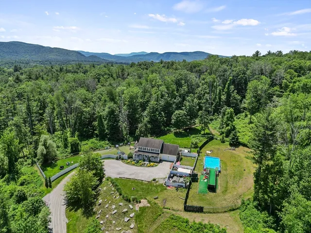 a view of a patio with chair and tables