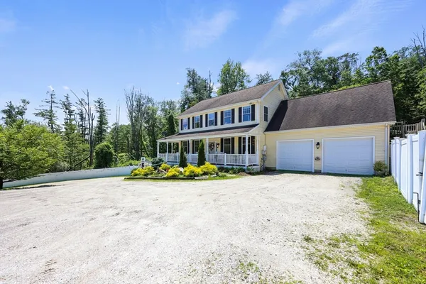 a view of house with outdoor space and swimming pool