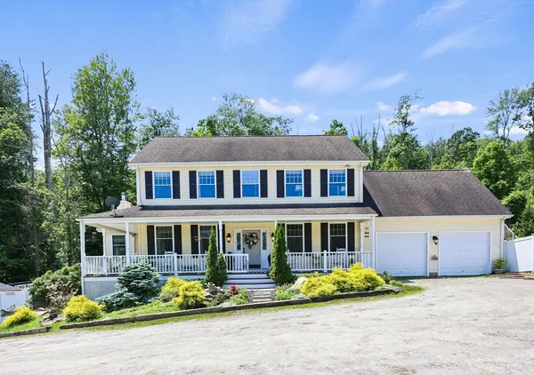 a front view of house with a yard