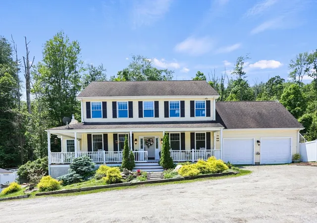 a front view of house with a yard