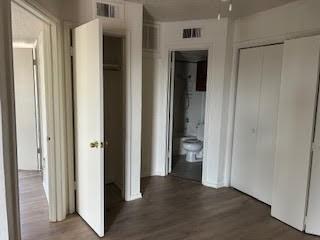 9520 Royal Lane, Unit 306 Dallas, TX 75243 - Photo 4 of 6 a view of a hallway with wooden floor and closet