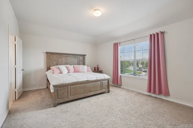 a bedroom with a bed and a cabinets